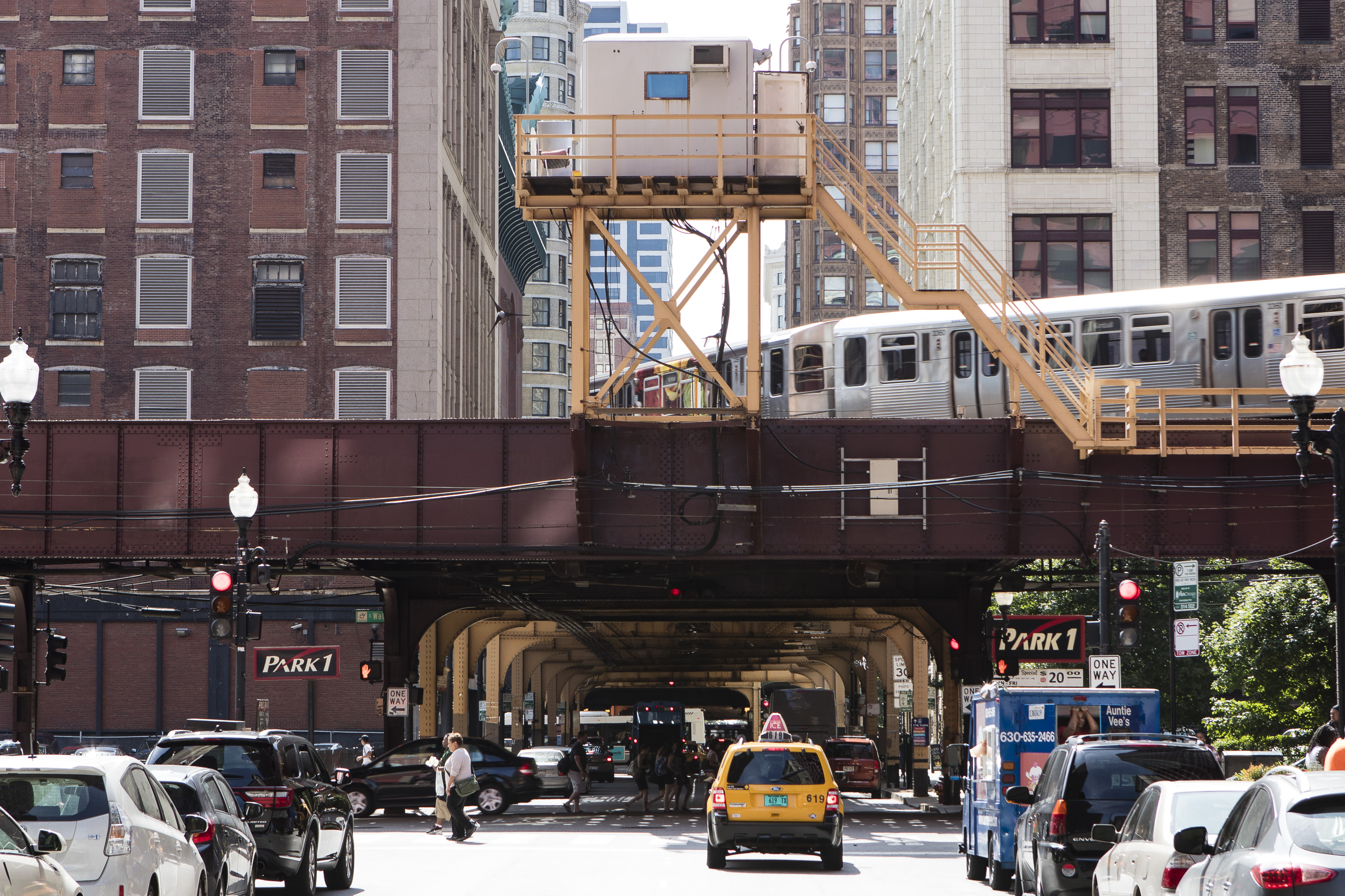 The Chicago Transit Authroity's pink line train passes over the 300 block of South Wabash Ave. Wednesday, July 15, 2015. (DePaul University/Jeff Carrion)