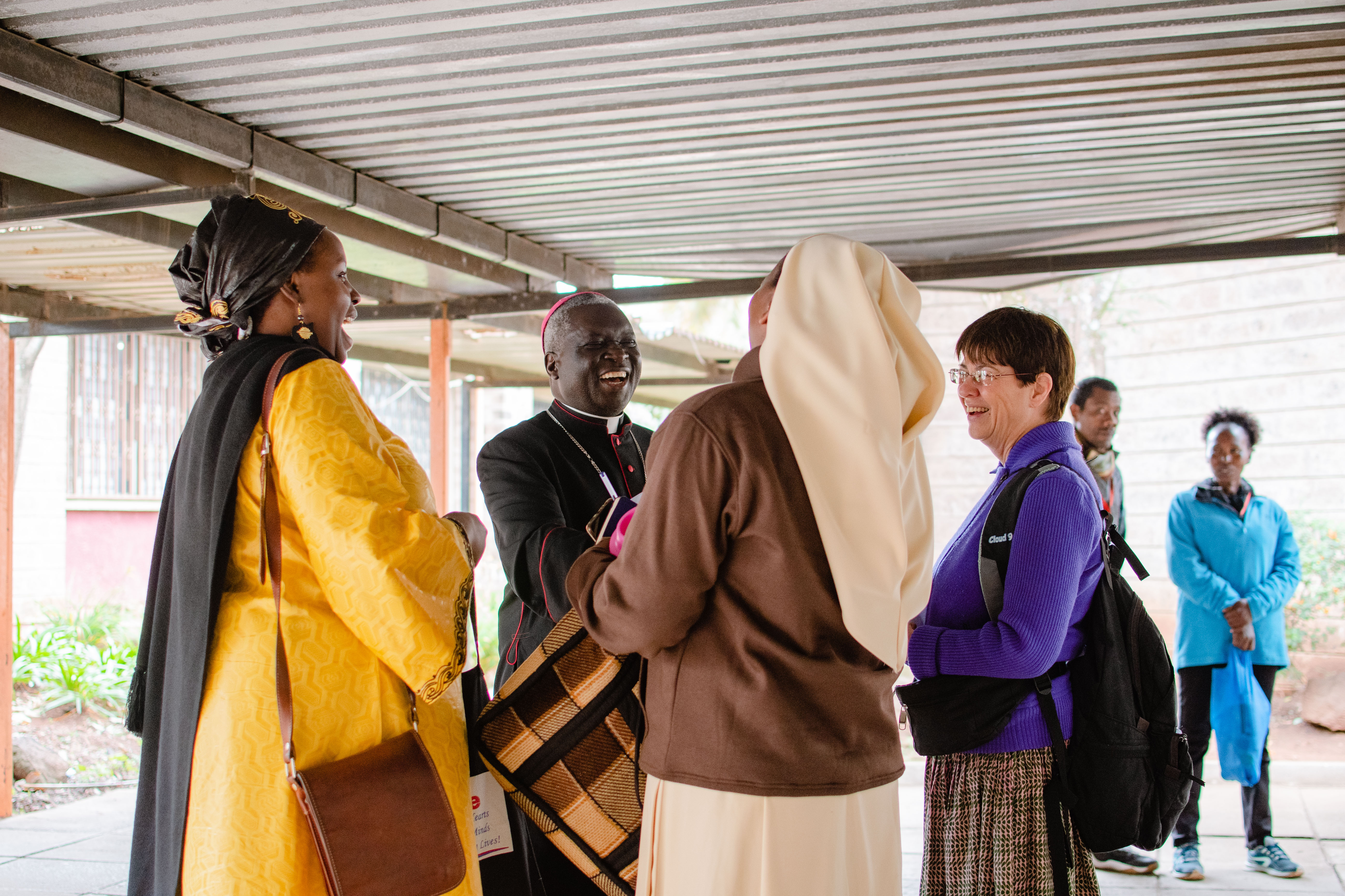 Four attendees of the 2nd Pan-African Catholic Congress speak.